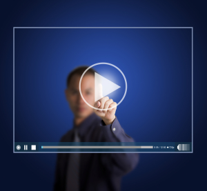 Conceptual Image of a Man Clicking on a Video Icon